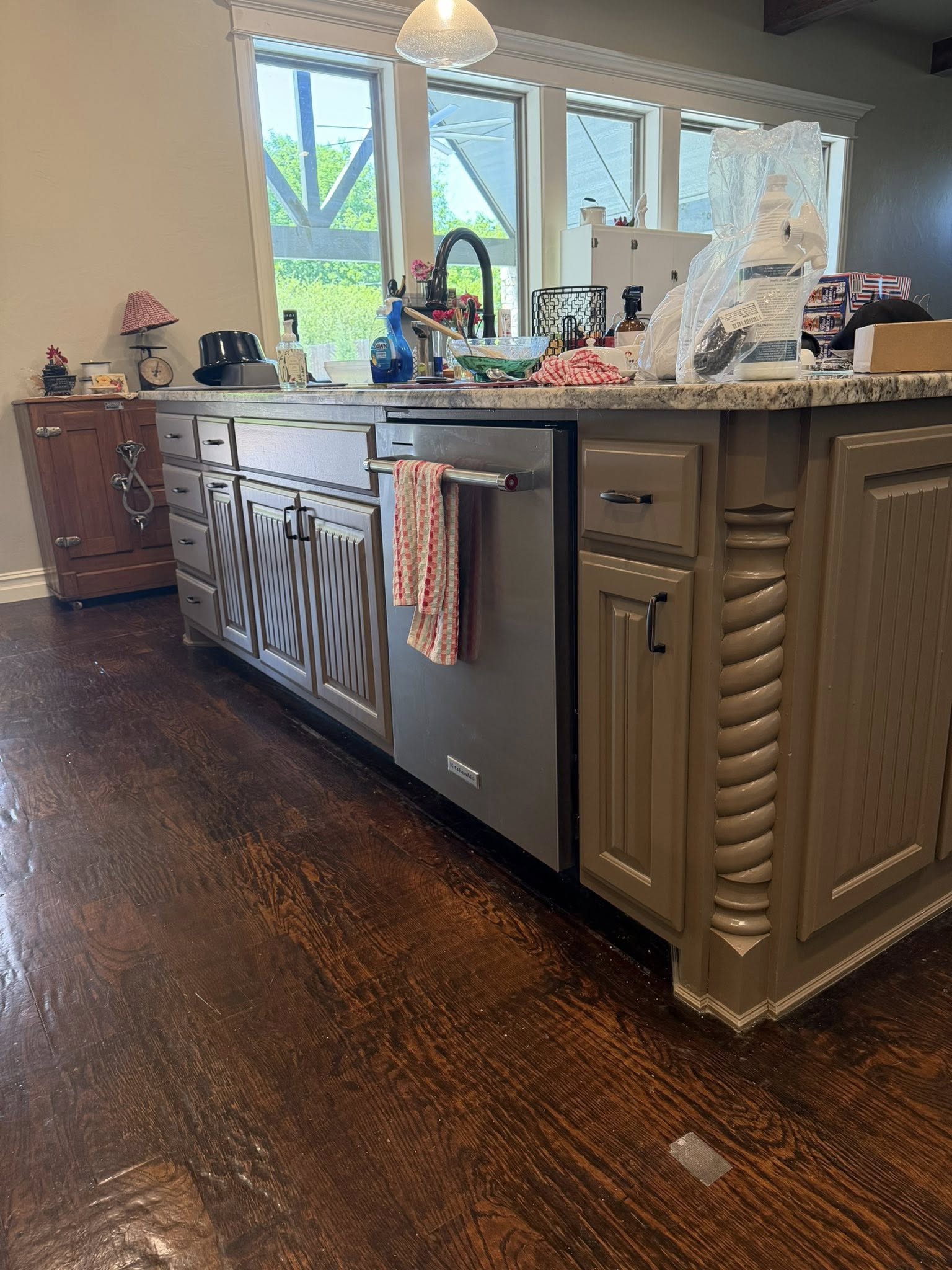 The same kitchen island refinished in a smooth modern gray