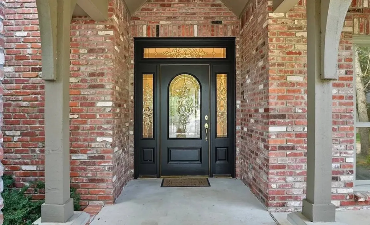 The same entry door refinished in a rich dark tone