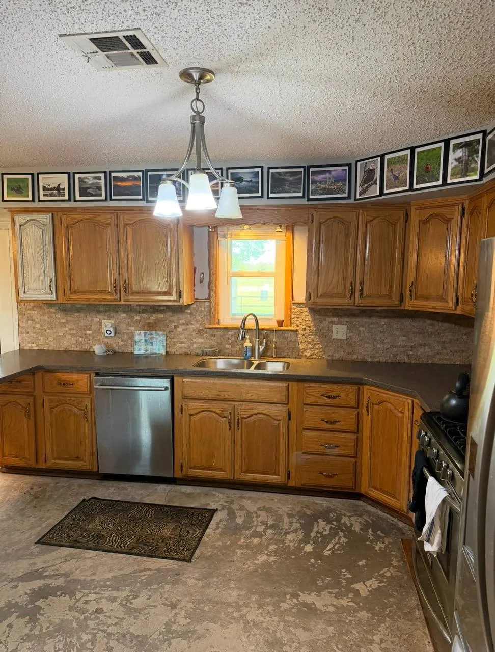 Dark wood kitchen cabinets before refinishing