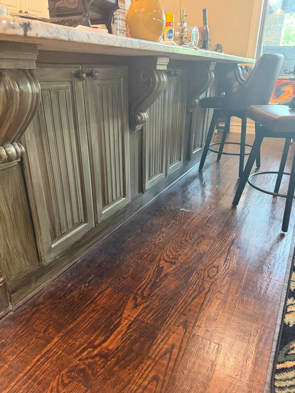 Ornate olive-green kitchen island before refinishing