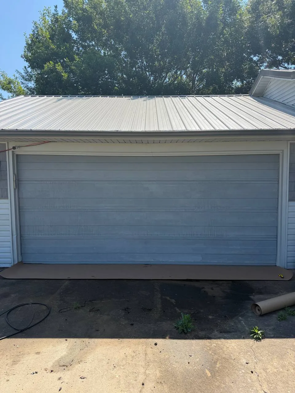 Faded garage door before repainting