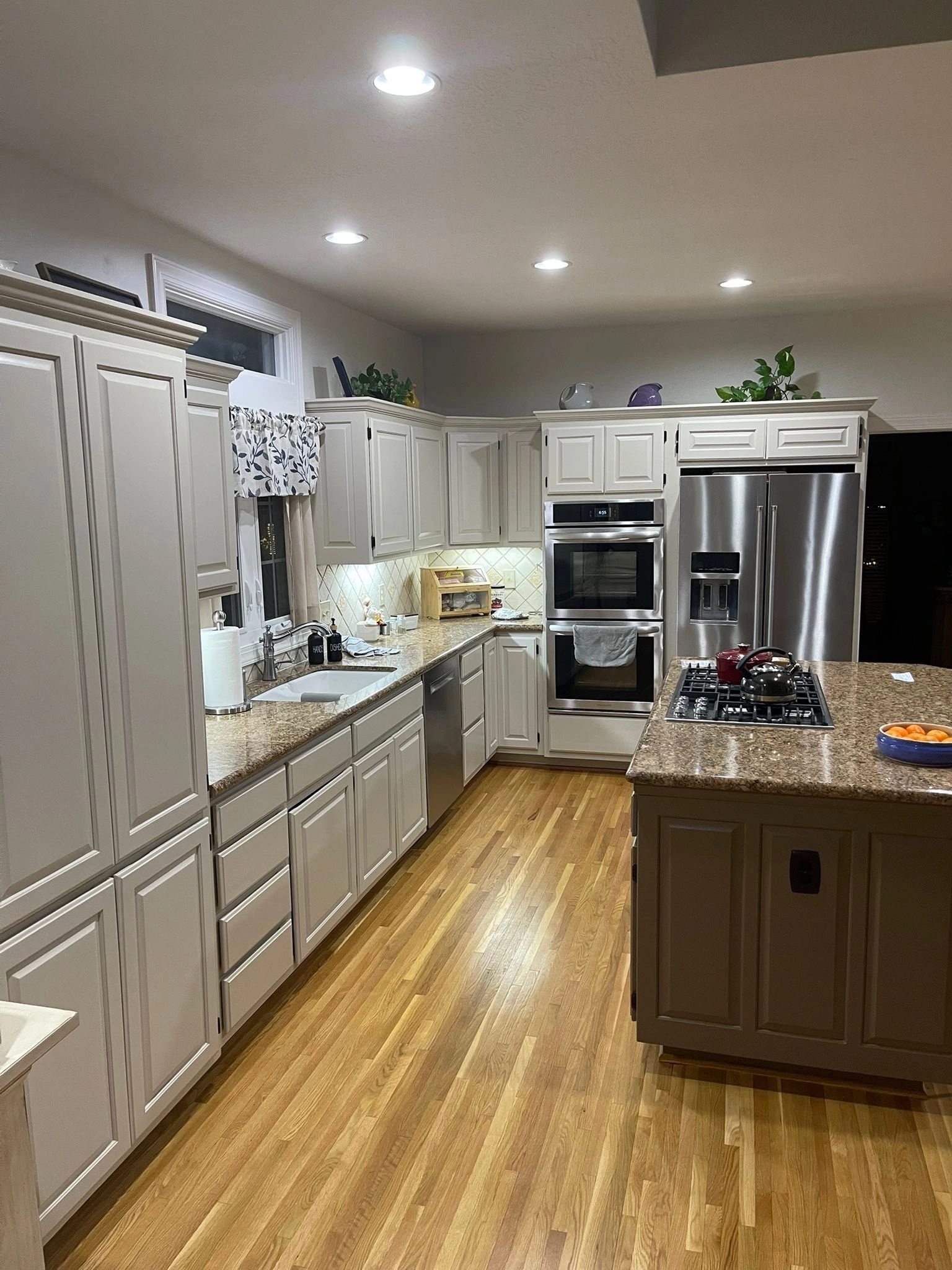 Kitchen with refinished cabinets and crown molding